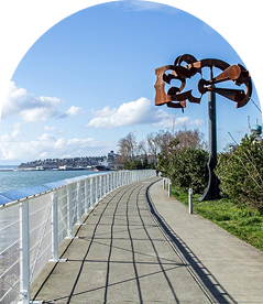 View of Seattle's waterfront with a Mark di Suvero metal sculpture along the Olympic Overlook walkway.
